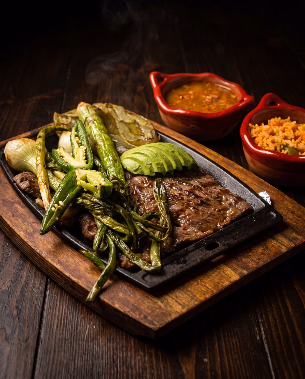 Skirt steak off the grill with chile toreado, charro beans and Mexican rice